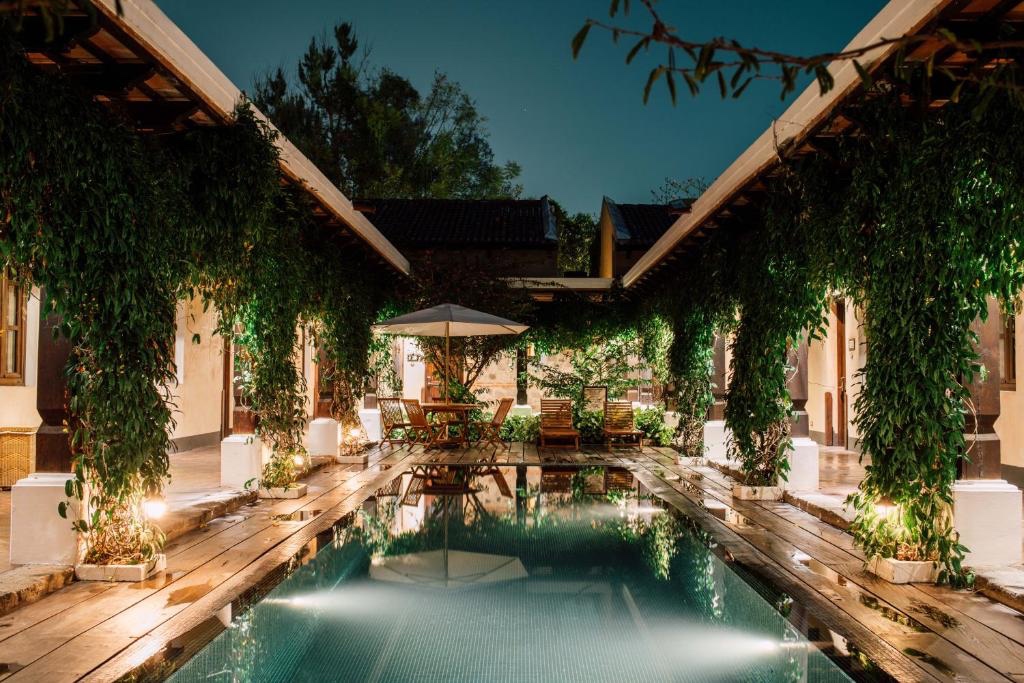 Porta Hotel Antigua colonial courtyard pool at night